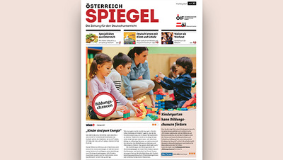 Eine Zeitung mit dem Titel "Österreich Spiegel" und Kindern, die mit Bauklötzen spielen.